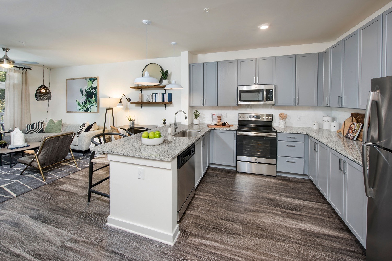 an open kitchen and living room with a table and chairs